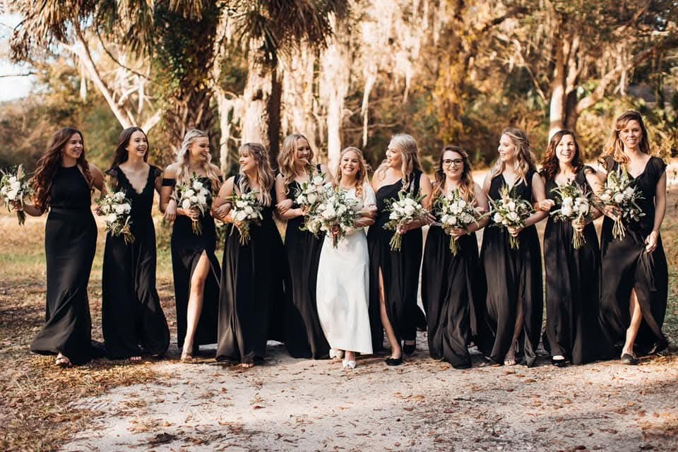 A bouquet for the bride and every bridesmaid, in white roses and trailing greenery