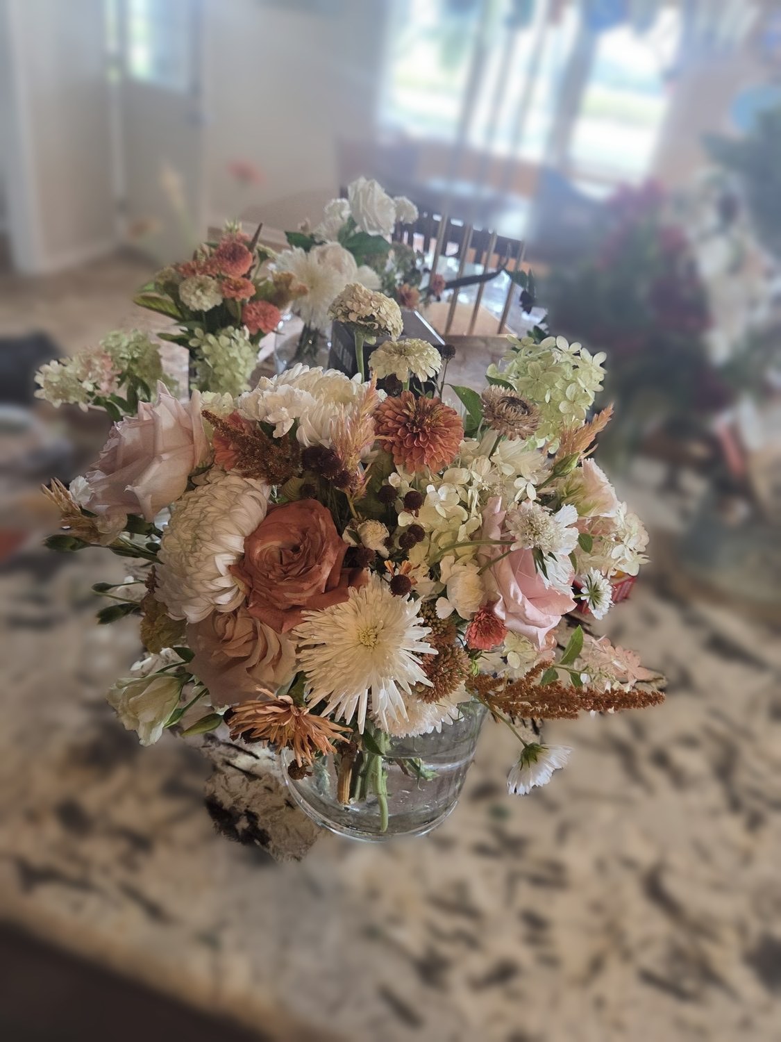 Toffee and blush roses with zinnias, mums, celosia and hydrangea